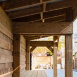 luxury backyard project featuring a coordinated pergola, modern shed, and stone walkway by UBL Group.